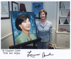 Laura Bush with her portrait in the White House